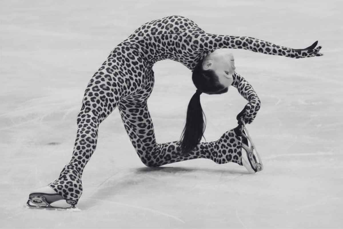 Knee slide pose figure skater