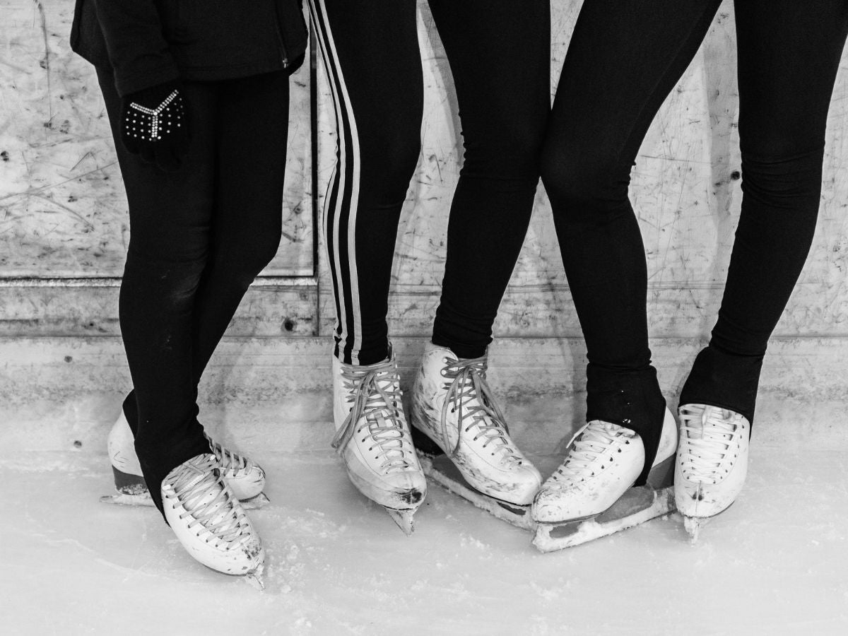 group of figure skater standing on the ice