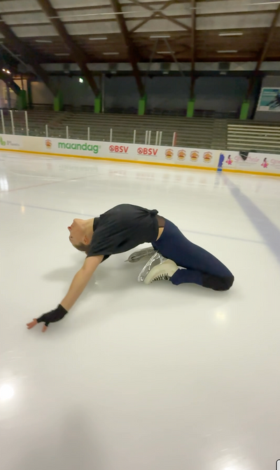 a figure skater doing a knee slide with edge athletica knee guards
